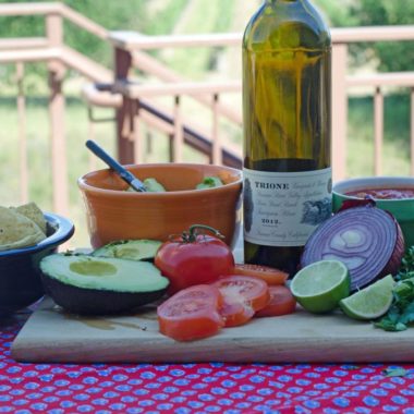 Guacamole ingredients and a bottle of Trione 2012 Sauvignon Blanc wine