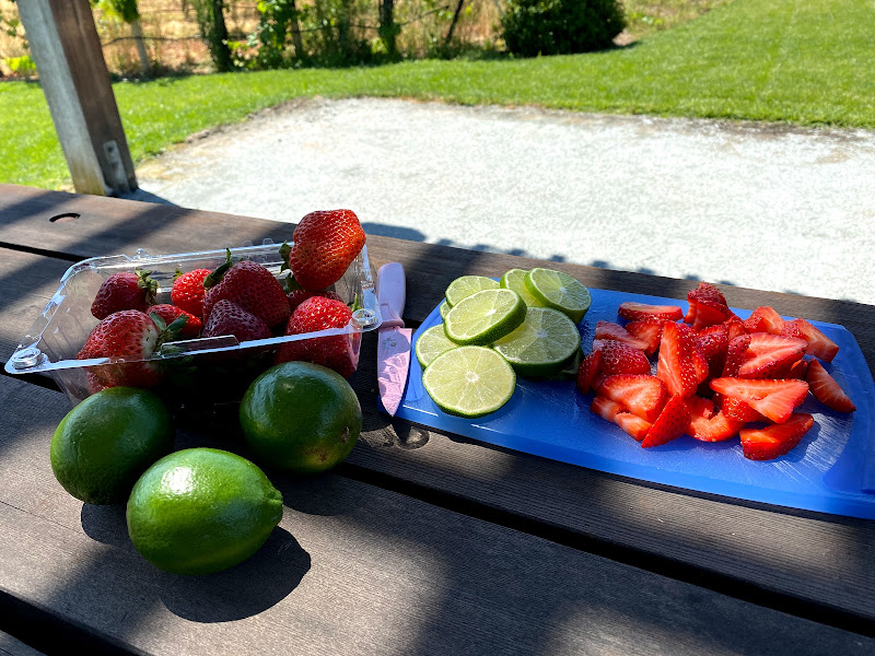 Chopped limes and strawberries for Sangria